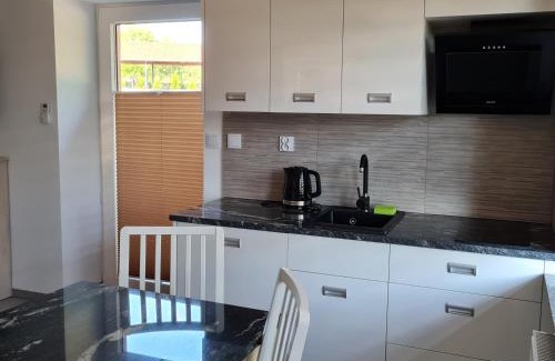 Faszcze Apartment | Top-Rated Apartamenty Zełwągi 15 with Pool & Family Appeal
