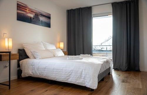 Eching Apartment | ApartHome: Serene Oceanfront Stay with Balcony Retreat
