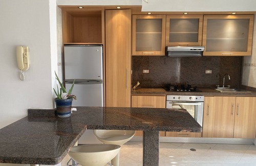 Lecherías Apartment | Cozy Apartment Steps from the Beach with Pool and Ocean View