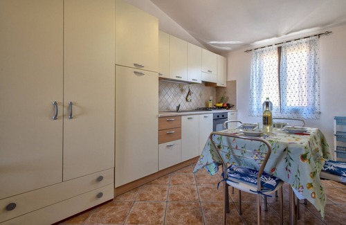 Trinita d'Agultu Apartment | Beautiful Oceanfront Apartment with Balcony in Trinità d’Agultu