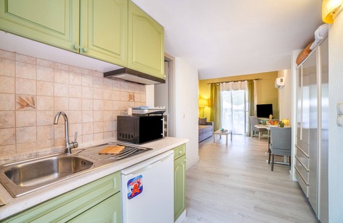 Limni House | Apartment 'Corfu Club Maisonette 2' with Shared Pool, Wi-Fi and Air Conditioning