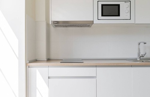 Villaverde de Pontones Apartment | Apartment for families or couples with double whirlpool bath and garden view.