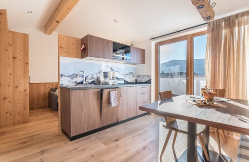 Fie allo Sciliar Apartment | Mountain View Apartment with Garden, Wi-Fi & Spa Amenities