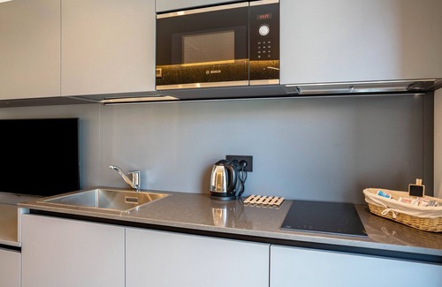 Ravina Apartment | Comfortable Apartment at Midum Garden Nord with Mountain View