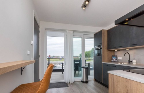 Sint-Annaland Apartment | Apartment in a unique location with a view of the marina and the Scheldt