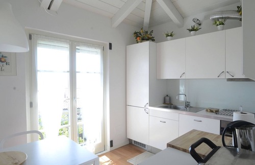 Carozzo Apartment | Inviting Villa Apartment with Sea View and Family-Friendly Perks