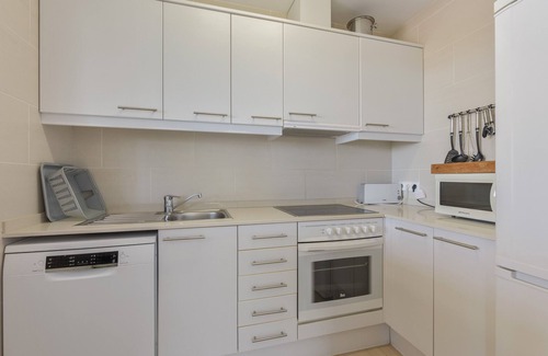 Coves Noves Apartment | Apartment 'Infinity View Menorca' with Sea View, Shared Pool and Private Terrace