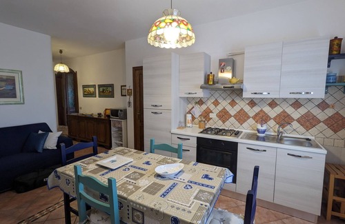 Lu Bagnu Apartment | Cozy Apartment Steps from the Sea with Oceanfront Pool