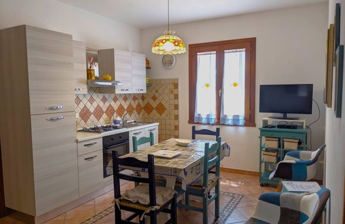 Lu Bagnu Apartment | Cozy Apartment Steps from the Sea with Oceanfront Pool