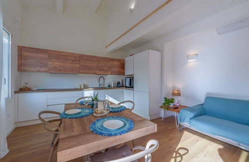 Santa Teresa di Gallura Apartment | Oceanfront Apartment 'Rena Bianca' with Balcony & Wi-Fi