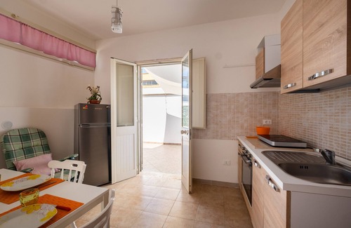Sant'Isidoro Apartment | Relaxing Apartment 'Oasi Del Conte' with Ocean View Terrace