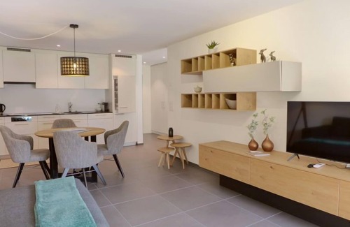 Blausee Apartment | Experience Verena by Interhome: Guest Rated 9.6 with Spa & Lake View