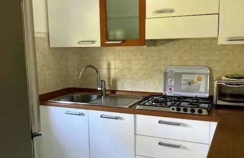 Cisano Apartment | Scenic Apartment with Lake View & Communal Pool, Rated 9.8