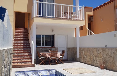 Tarajalejo Apartment | Cozy Apartment with Pool Steps from the Beach