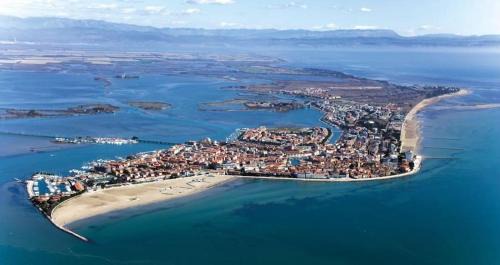 Grado Apartment | Modern Apartment with Terrace & Free Parking Near the Beach