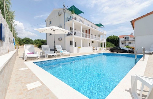Tribunj Apartment | Discover Apartments Mila: Oceanfront Oasis with Pool
