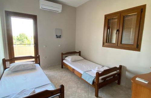 Ormos Panagias Apartment | Discover Aphrodites Gardens: Pet-Friendly Family Retreat