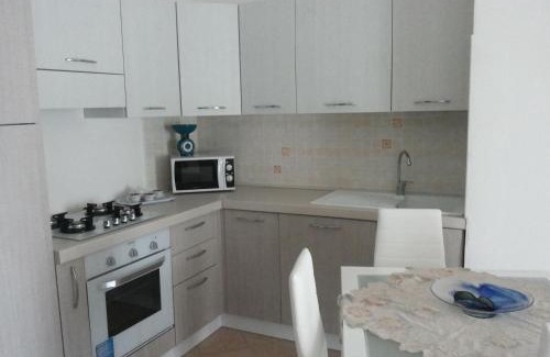 La Muddizza Apartment | Pet-Friendly Appartamenti Isola Rossa with Ocean View Pool