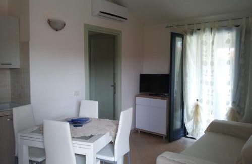 La Muddizza Apartment | Pet-Friendly Appartamenti Isola Rossa with Ocean View Pool