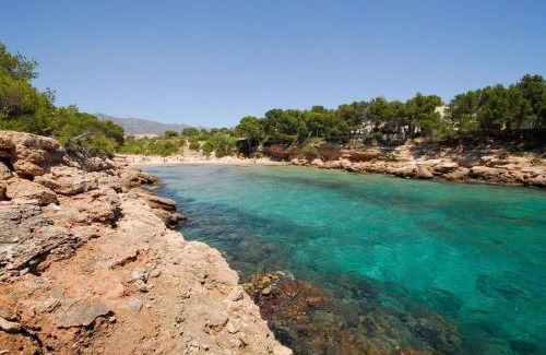L Almadrava Apartment | Beautiful Oceanfront Apartment with Pool and Garden Oasis