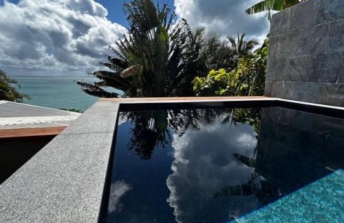 Perinet Apartment | Serenity Appt: Poolside Retreat with Ocean Views