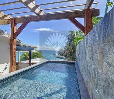 Perinet Apartment | Serenity Appt: Poolside Retreat with Ocean Views