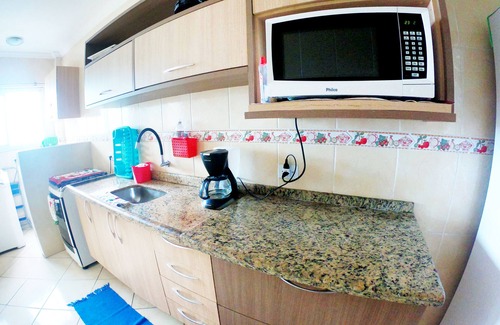 Balneario Paqueta Apartment | Oceanfront Retreat: Balcony, Barbecue & Beach Views