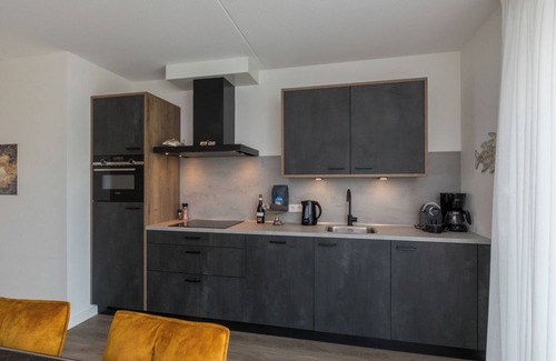 Sint-Annaland Apartment | Elegant Vista Maris Apartment with Spa and Kitchen Amenities