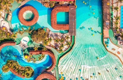 Olimpia Apartment | Relax at Apto do Veloso Resort: 4-Star, Pool & Spa Access
