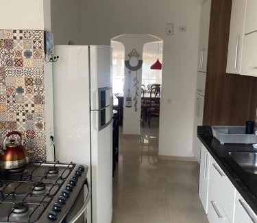 Vila Luis Antonio Apartment | Oceanfront Escape at Apto Pé Na Areia - Praia das Astúrias