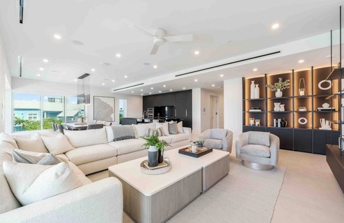 Seven Mile Beach Condo | Aqua #2: Full-Floor Luxury Condo on 7Mile Beach w/Oceanfront Terrace, Private Hot Tub, & Communal Pool.