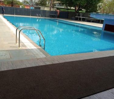 Girinagar Resort | Discover Aquarius Resort: Family-Friendly with Pool Access