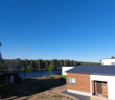 Rovaniemi House | Serene Arctic River Chalet with Private Beach & Ocean Views