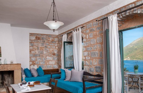 Karavostasi Apartment | Discover Artemis: Traditional Stone Built Studio Retreat