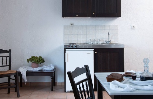 Karavostasi Apartment | Discover Artemis: Traditional Stone Built Studio Retreat