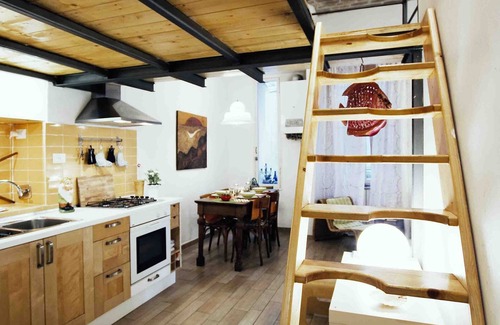 Esquilino Apartment | Artist's House: Steps from Colosseum with Family Amenities