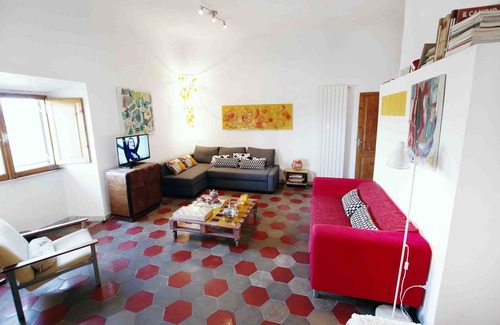 Esquilino Apartment | Artist's House: Steps from Colosseum with Family Amenities