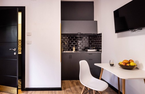 Haifa Apartment | Artistic Vibes: Orange Studio with Kitchen by the Sea