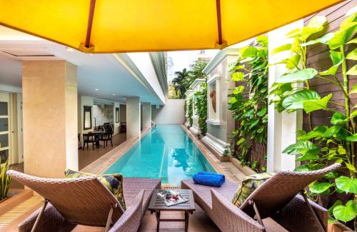 Embassy District Apartment | Discover Comfort at 21 Saladaeng with Poolside Relaxation