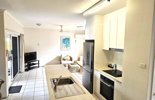 Port Douglas Apartment | Relax at The Mango Tree: Oceanfront Retreat with Spa