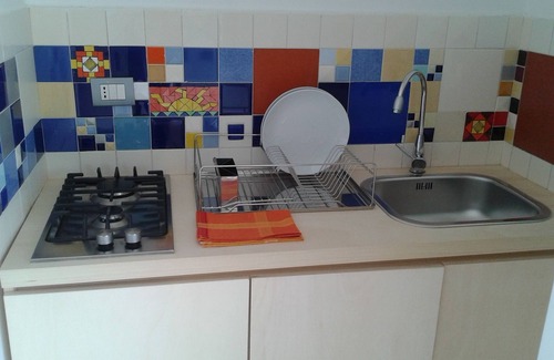 Cammarata Apartment | Discover ATELIER DEI CILIEGI with a Cozy Kitchen Retreat