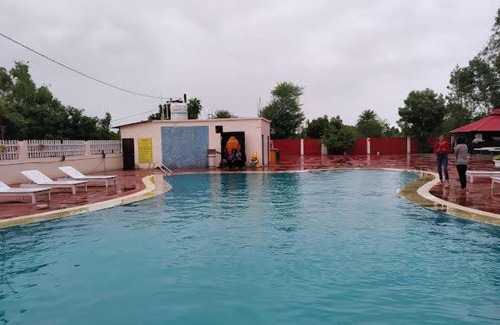 Marhi Hotel | Discover Atharva Greens Club and Resorts with Pool Access