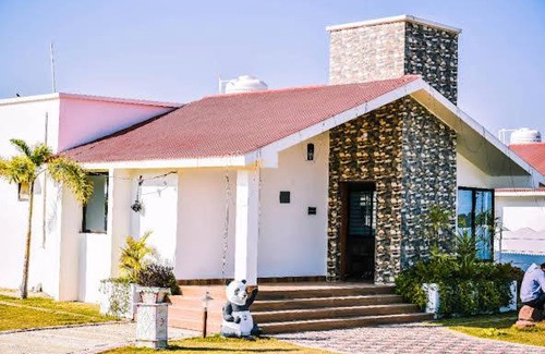 Marhi Hotel | Discover Atharva Greens Club and Resorts with Pool Access