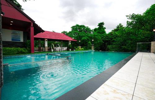 Athirapally Hotel | Relax at Athirappilly Rainland Resort with Pool and Dining