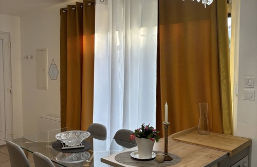 Miplaine Apartment | Cozy Retreat Near Eurexpo with Spa and Hot Tub Amenities
