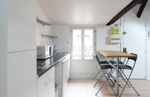 Saint-Mande Apartment | Charming Attic Apartment with Exposed Beams & Family-Friendly