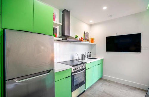 Greater East End Apartment | Inviting Avocado Container @EADO with Hot Tub Amenities