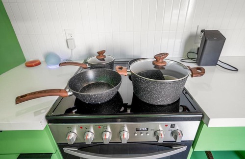 Greater East End Apartment | Inviting Avocado Container @EADO with Hot Tub Amenities