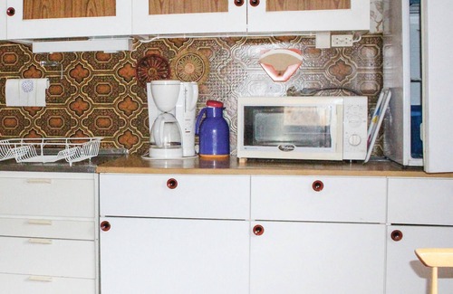 Fresvik House | Experience a Cozy Cottage Amidst Scenic Orchards