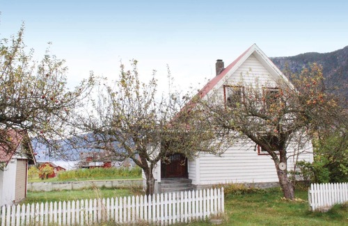Fresvik House | Experience a Cozy Cottage Amidst Scenic Orchards